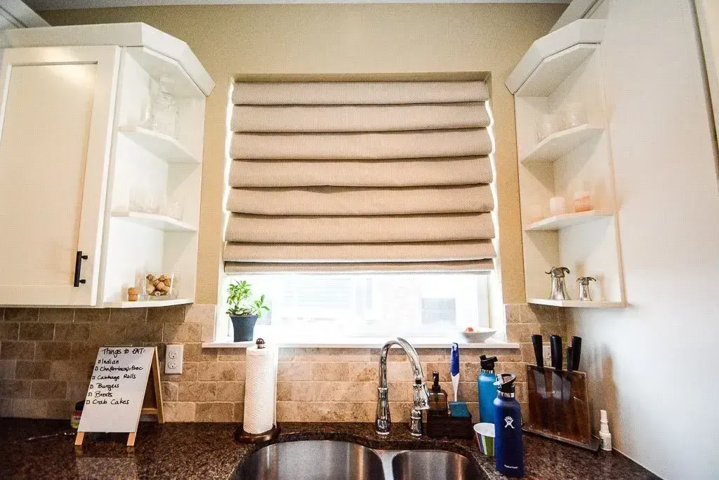 Soft Fold Roman Shades installed in a Denver home by Blinds Couture